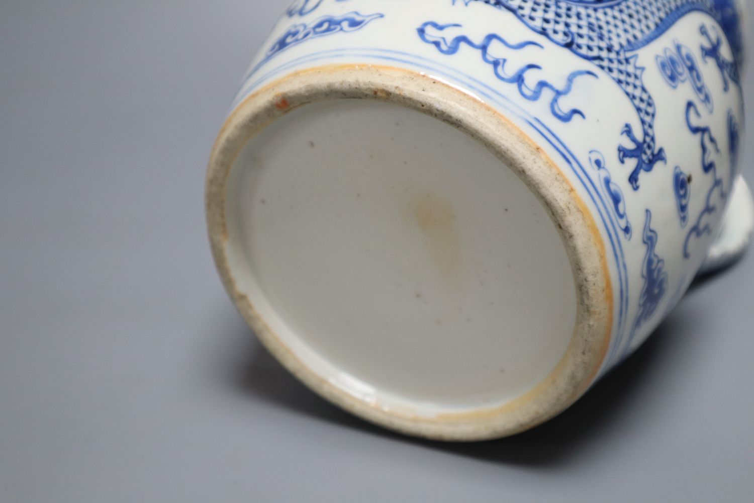 A 19th century Chinese blue and white dragon jug, 22cm
